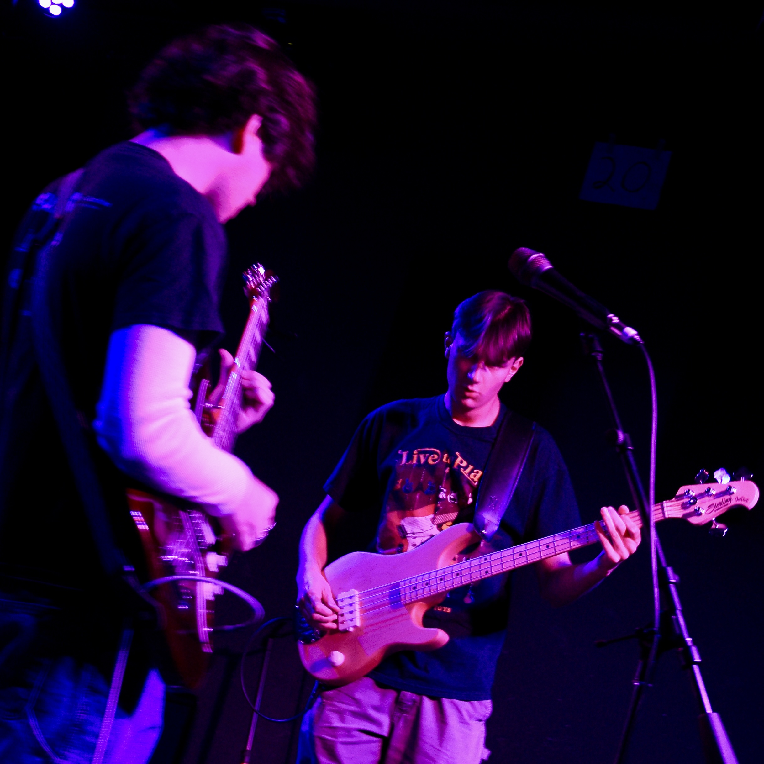 Two men playing guitars